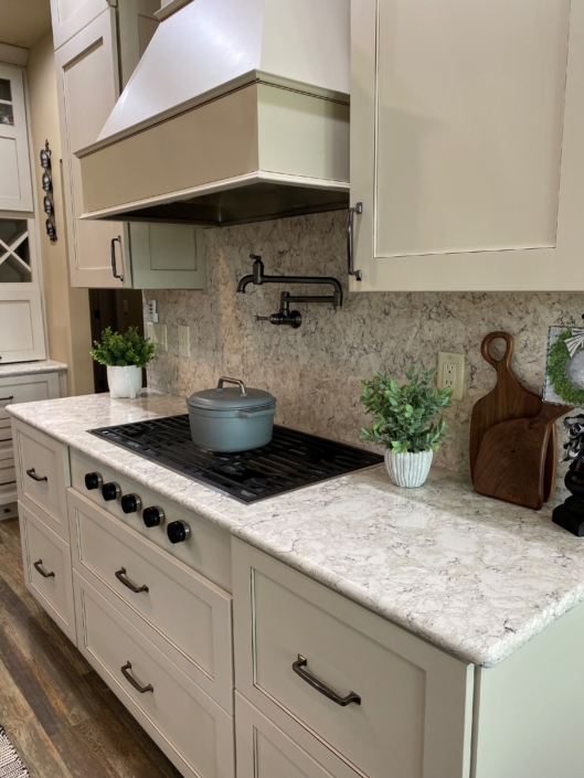 Quartz countertop and backsplash in a newly designed kitchen.